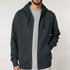 Front view of men’s dark heather gray organic cotton brushed heavyweight zip up sweatshirt on model – Louvóre apparel
