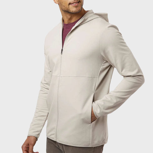 Front side angled view of men’s cream oat beige performance zip up hooded jacket on model – Louvóre apparel