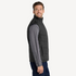 Side view of men’s black water resistant puffer vest with chest pockets on model – Louvóre athleisure apparel