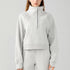 Front view of women’s ash gray cropped oversized half zip hoodie on model – Louvóre athleisure apparel