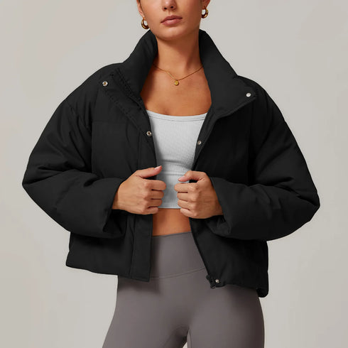Front view of women’s black down filled puffer jacket on model – Louvóre athleisure apparel