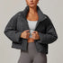 Front view of women’s gray down filled puffer jacket on model – Louvóre athleisure apparel