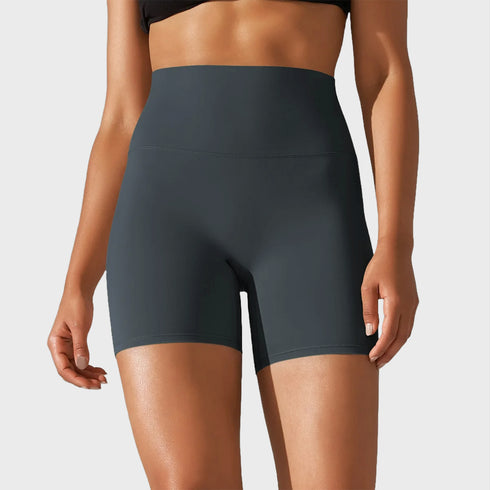 Front view of women’s dark seal blue high waisted yoga biker shorts on model – Louvóre athleisure apparel