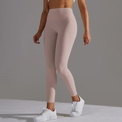 Front view of women’s blush high waisted yoga leggings on model – Louvóre athleisure apparel