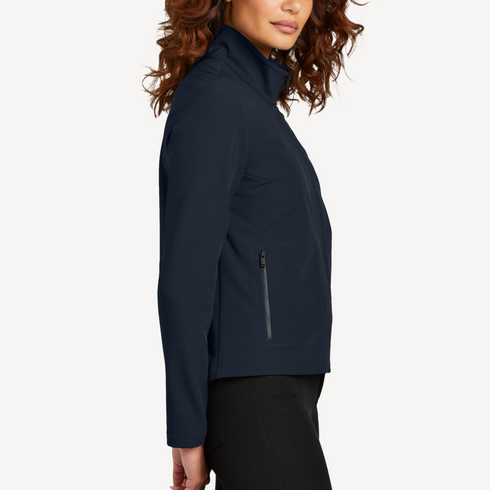 Side view of women’s navy stretch soft shell jacket on model – Louvóre apparel