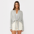 Zoomed in front view of women’s heather gray waffle knit long sleeve tie front cardigan on model – Louvóre athleisure apparel