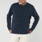 Man wearing a navy blue organic crewneck sweater