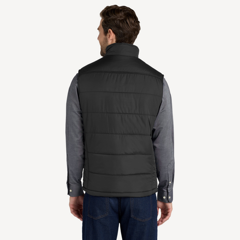 Back view of men’s black water resistant puffer vest with chest pockets on model – Louvóre athleisure apparel