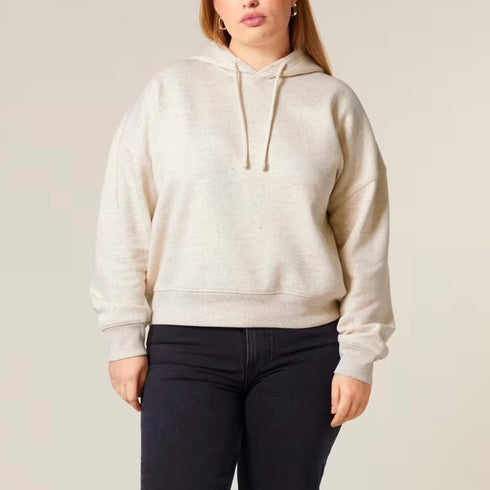 A woman wearing an oversized cropped mid-weight organic hoodie