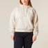 A woman wearing an oversized cropped mid-weight organic hoodie